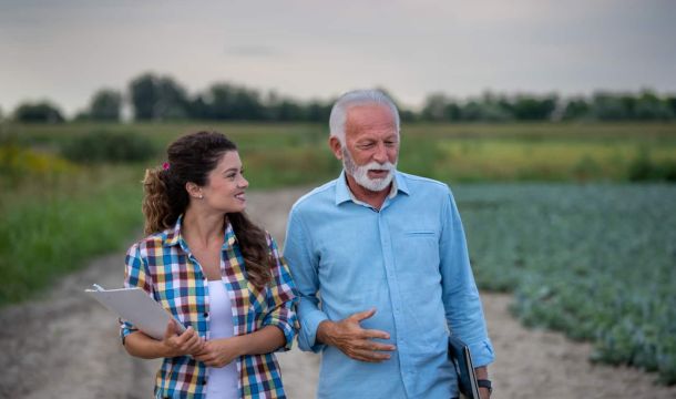 Family business discussion in field