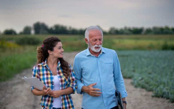 Family business discussion in field