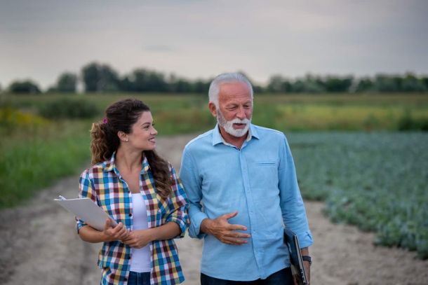 Family business discussion in field